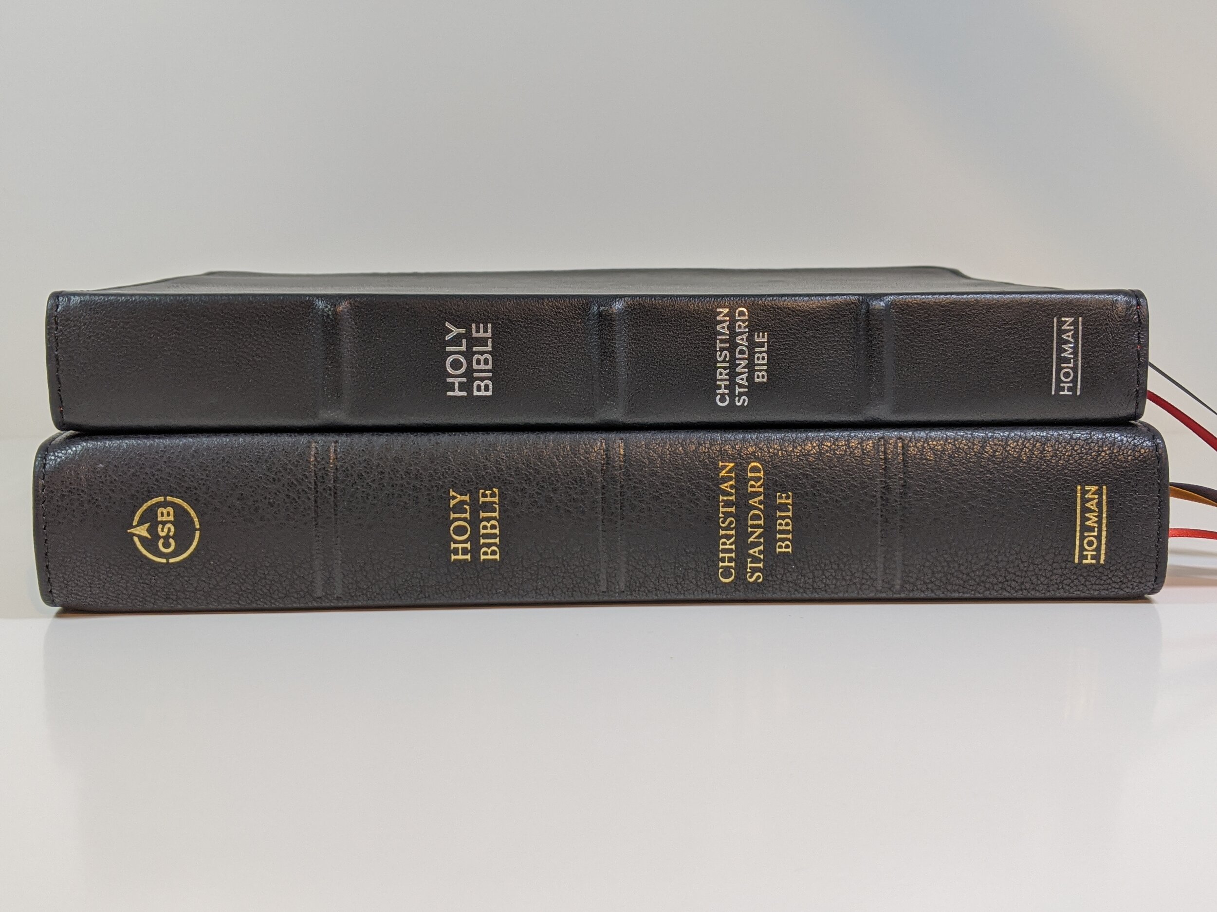  top - CSB Large Print Ultra Thin  bottom - CSB Verse-by-Verse 